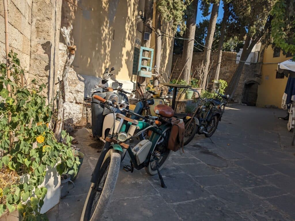 vintage bicycles lined up on stone street in the Old City of Rhodes Greece
